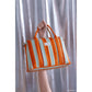 Organizador de cochecito y mini bolso stories limited edition - Green orange stripes